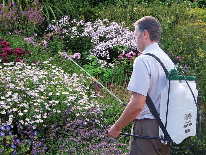 Sprayer being used on weeds